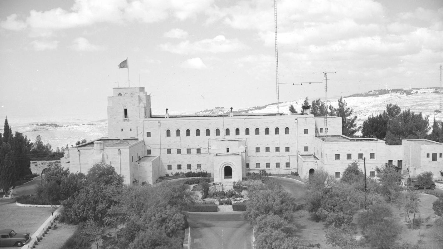 A black and white photo of a large white buidling