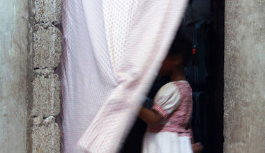 Women and children are disproportionately affected. According to the Office of the UN High Commissioner for Refugees (UNHCR), young girls are the most demanded and profitable prey for traffickers. Above, a child stands in a curtained doorway in Yemen. UNHCR/Rocco Nuri