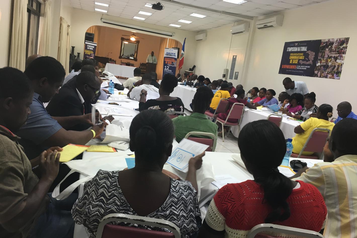 A room of people sitting at desks